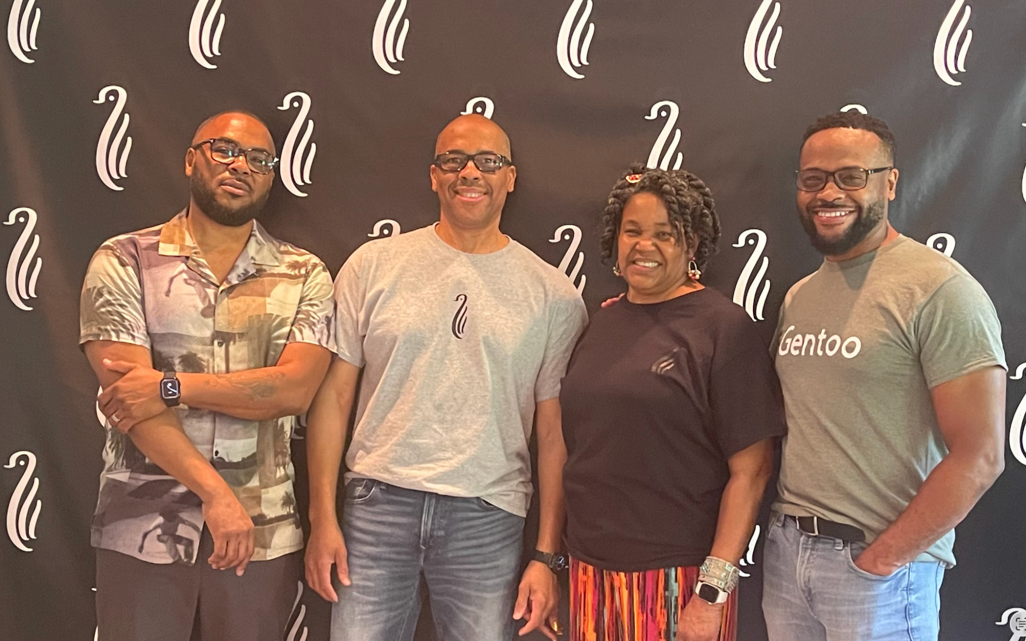 Family members together in front of the Gentoo backdrop at Faith, Family and Finance 2023